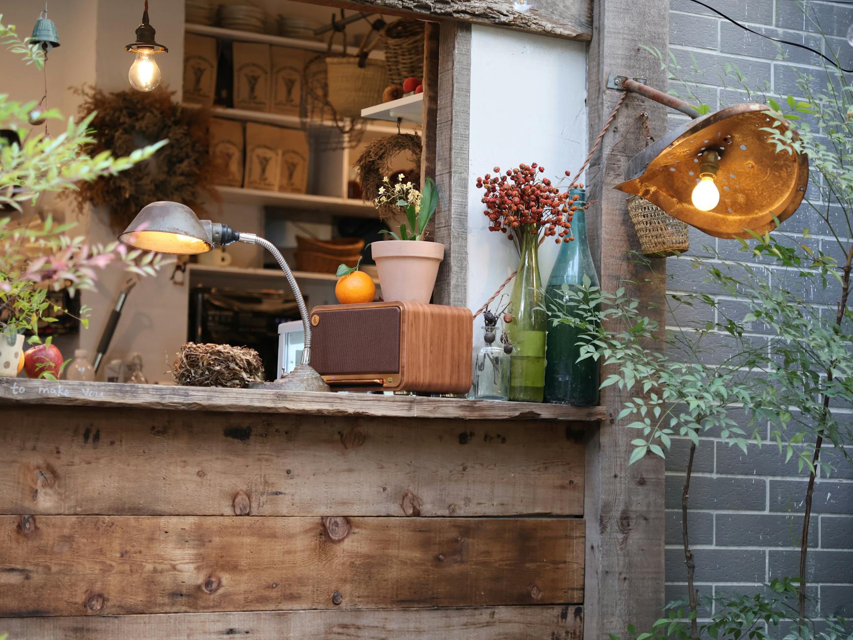 Rustic cafe window with vintage lamps and warm decor, perfect for an inviting ambiance