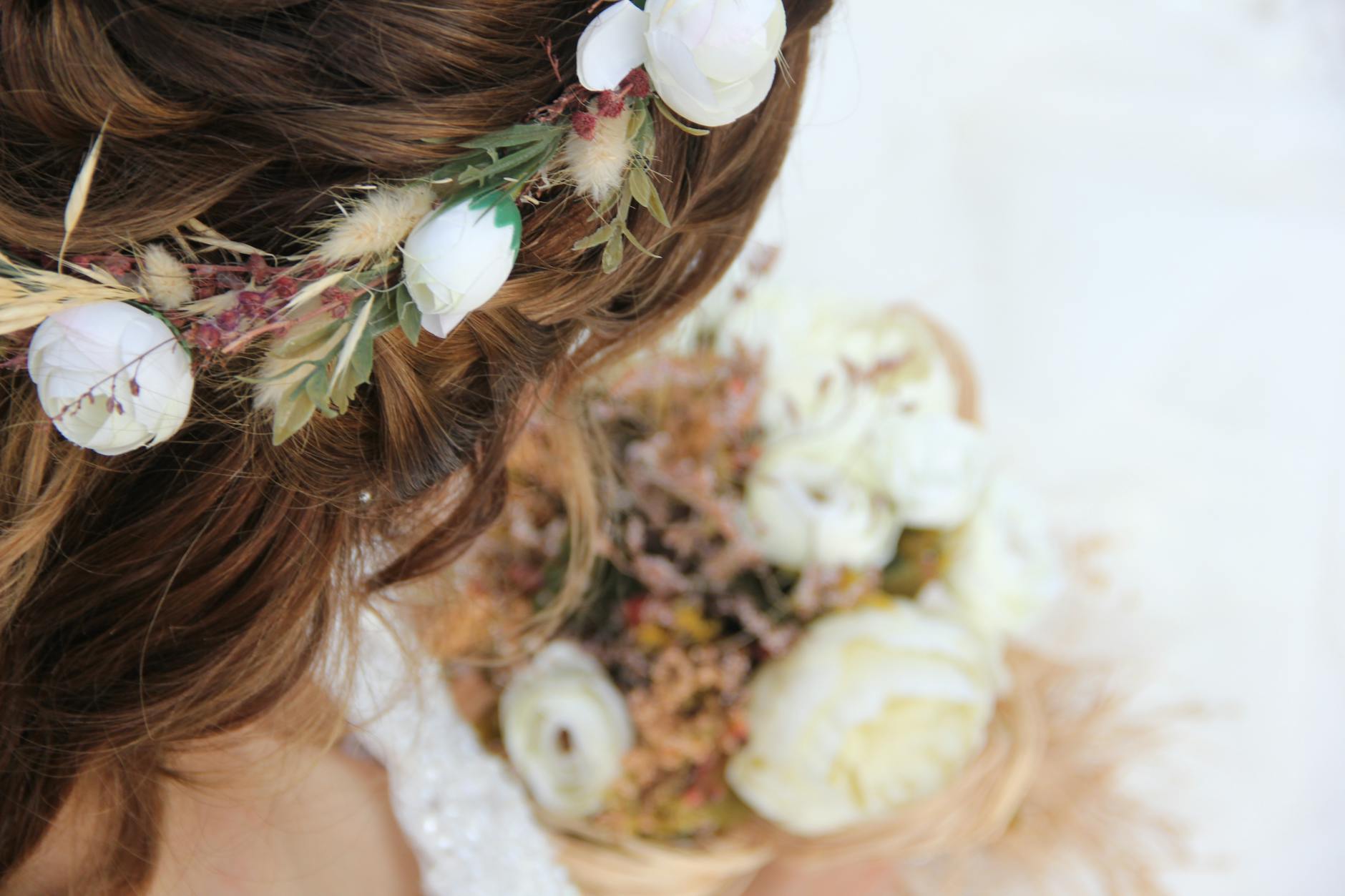 Close-up of a woman with floral hairstyle, perfect for wedding or bridal themes.