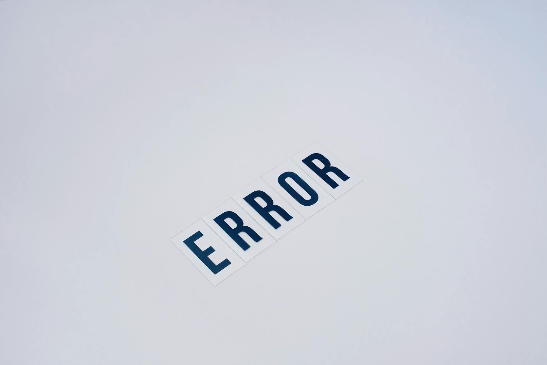 Simple and minimalist image showcasing the word 'ERROR' on a white background.